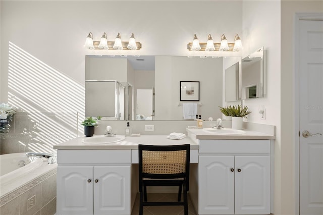 bathroom featuring vanity and independent shower and bath