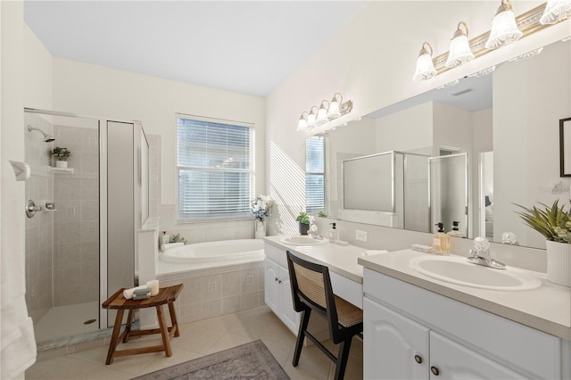 bathroom featuring vanity, independent shower and bath, and tile patterned flooring