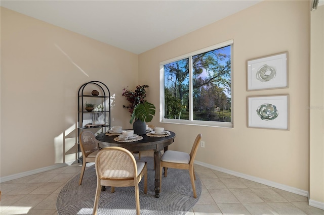 dining space with light tile patterned floors