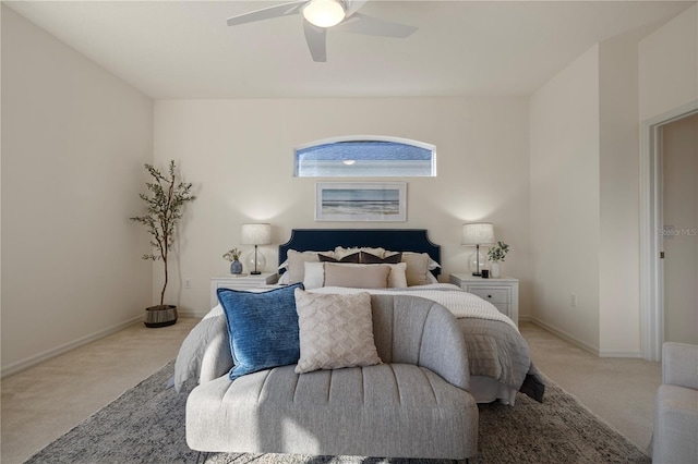 bedroom featuring light colored carpet and ceiling fan