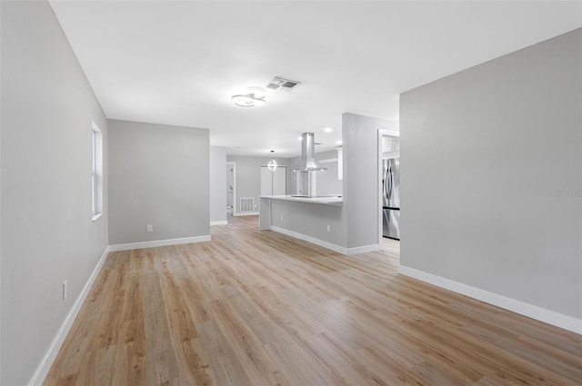 unfurnished living room featuring light wood-type flooring