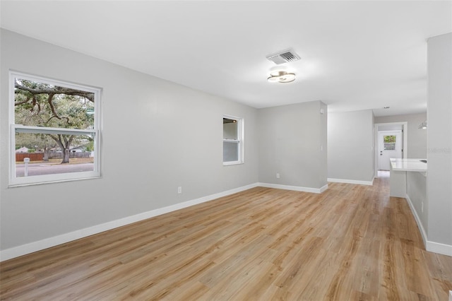 unfurnished room featuring light wood-type flooring