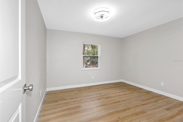 spare room with light hardwood / wood-style flooring