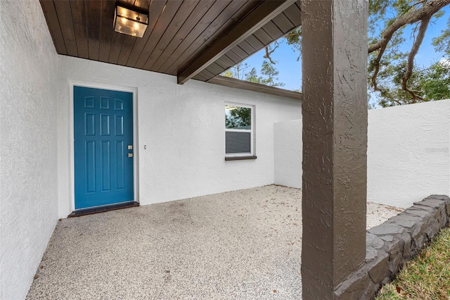 doorway to property with a patio area