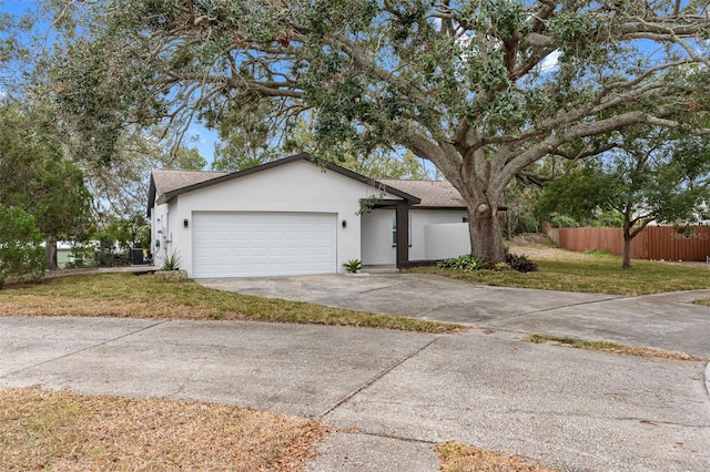 view of front of house featuring a garage and a front lawn