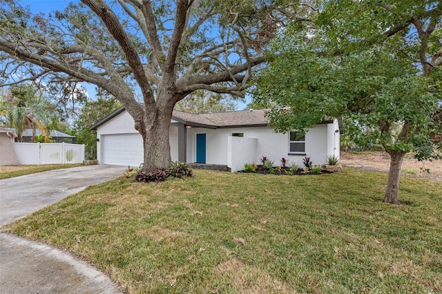 view of front facade with a garage and a front lawn