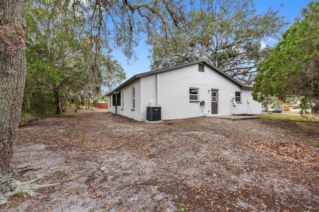 view of property exterior with central AC unit