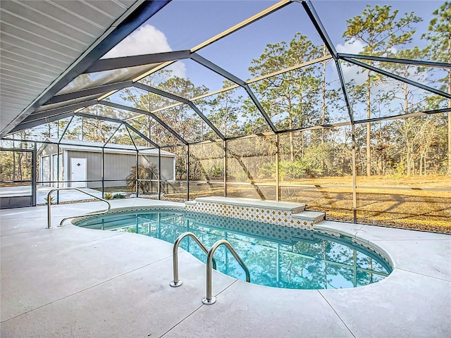 view of pool featuring a lanai, an outdoor structure, and a patio