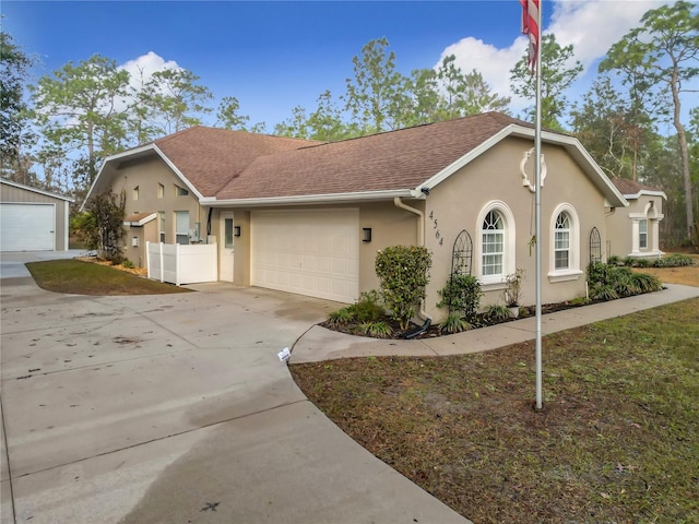 single story home with a garage