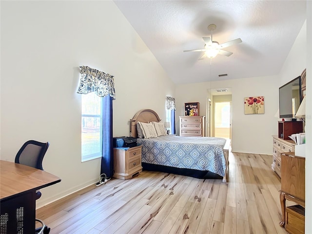 bedroom featuring lofted ceiling, ceiling fan, and light hardwood / wood-style flooring