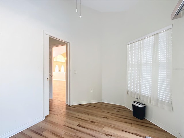 unfurnished room with light hardwood / wood-style floors