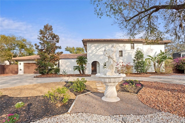 mediterranean / spanish-style house featuring a garage