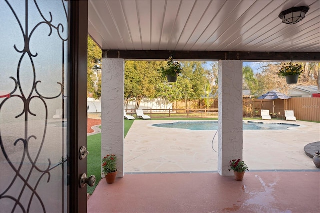 view of swimming pool featuring a patio area