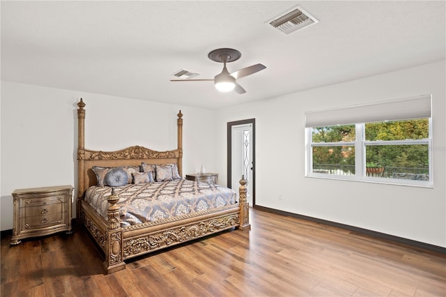 bedroom with hardwood / wood-style flooring and ceiling fan