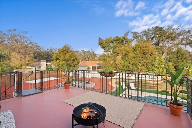 view of patio / terrace with an outdoor fire pit