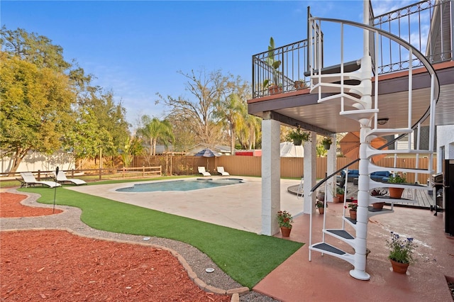 view of swimming pool with a patio