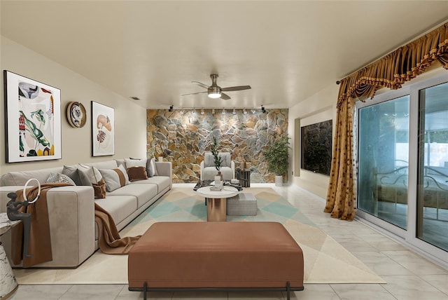 living room featuring track lighting and ceiling fan