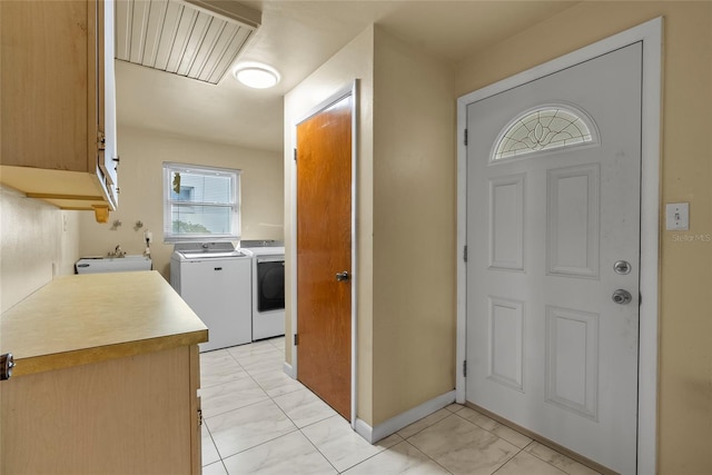 kitchen featuring independent washer and dryer and sink