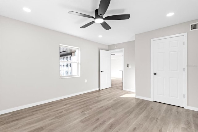 unfurnished bedroom with light hardwood / wood-style flooring and ceiling fan