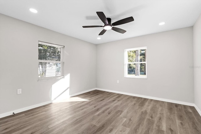 empty room with wood-type flooring and ceiling fan