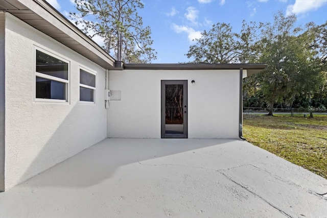 entrance to property with a patio area