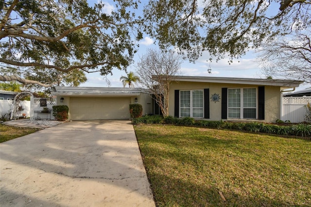 single story home featuring a garage and a front yard