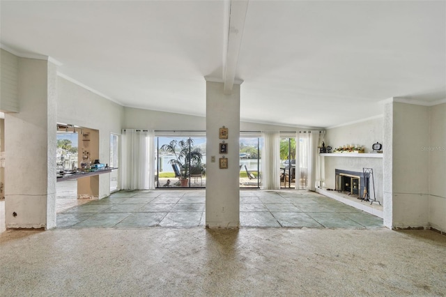 1897 Clearwater Harbor Dr, Largo, FL 33770 - unfurnished living room with plenty of natural light, a glass covered fireplace, and ornamental molding