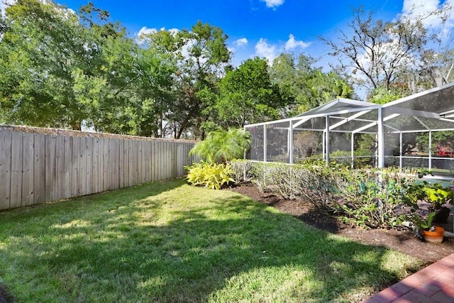 view of yard featuring a lanai