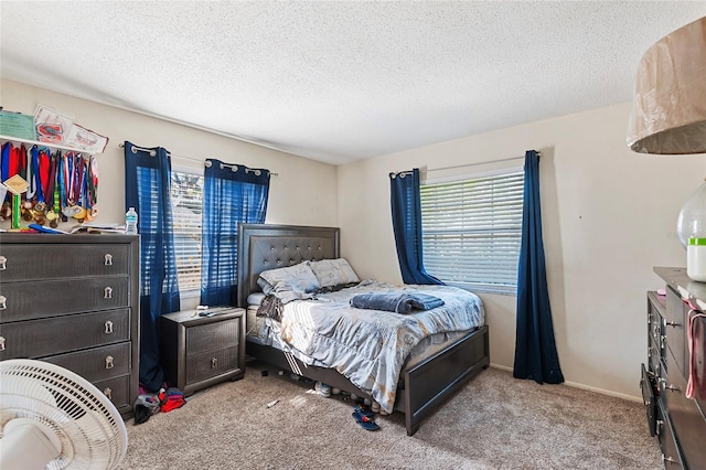 carpeted bedroom with a textured ceiling