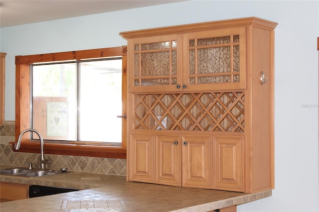 1322 Kenmore St, Port Charlotte, FL 33952 - kitchen featuring a healthy amount of sunlight, sink, and decorative backsplash