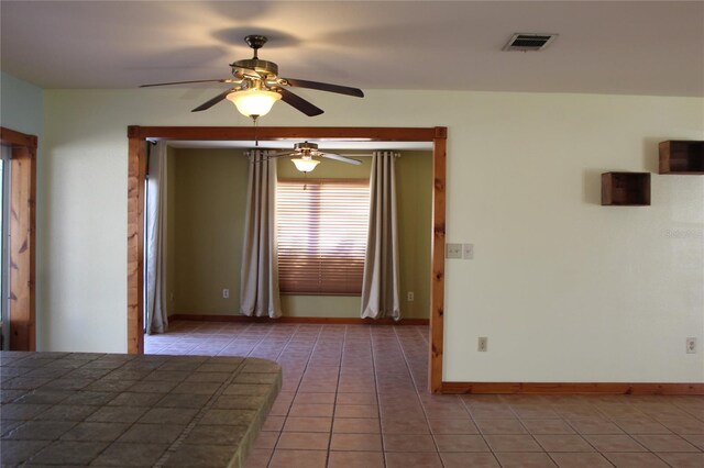 1322 Kenmore St, Port Charlotte, FL 33952 - unfurnished bedroom with tile patterned flooring and ceiling fan