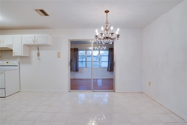 unfurnished dining area with a notable chandelier