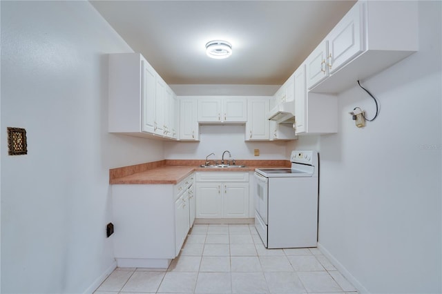 kitchen featuring light tile patterned floors, white electric stove, sink, and white cabinets