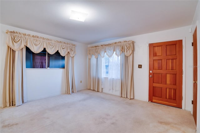 spare room featuring carpet floors