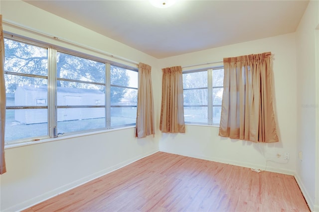 unfurnished room featuring light hardwood / wood-style floors