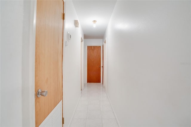 hallway featuring light tile patterned flooring