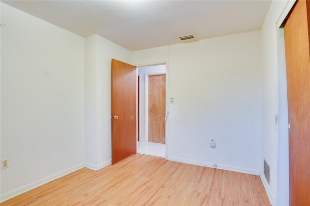 unfurnished bedroom featuring light wood-type flooring