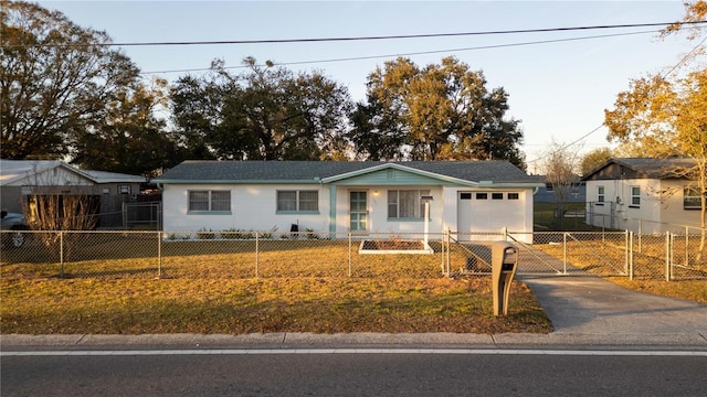 view of front of house featuring a garage and a front yard