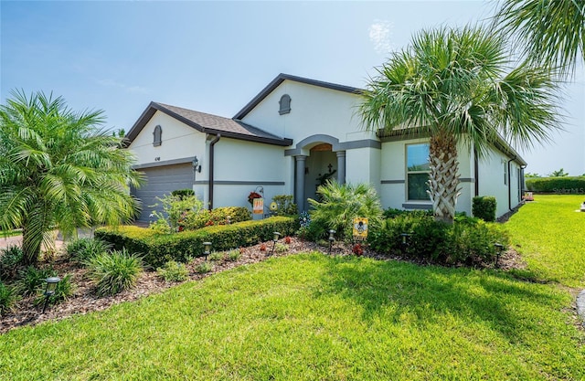 4748 Ballast Crest Cv, Land O Lakes, FL 34638 - view of front of house with an attached garage, stucco siding, and a front yard