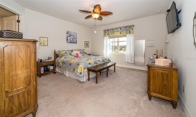 4748 Ballast Crest Cv, Land O Lakes, FL 34638 - bedroom with light carpet, baseboards, and a ceiling fan