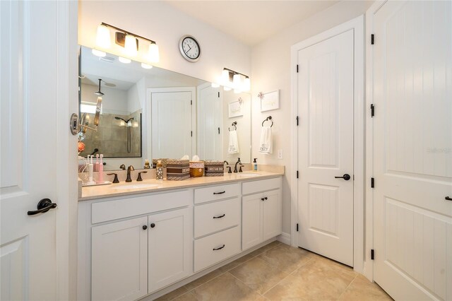 4748 Ballast Crest Cv, Land O Lakes, FL 34638 - bathroom featuring a shower stall, double vanity, and tile patterned flooring