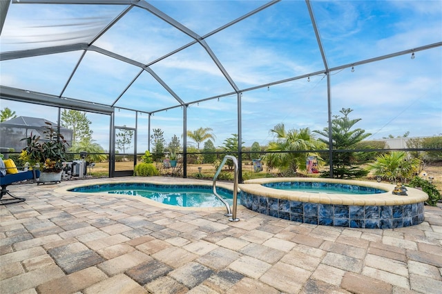 4748 Ballast Crest Cv, Land O Lakes, FL 34638 - outdoor pool featuring an in-ground hot tub, a patio area, and glass enclosure