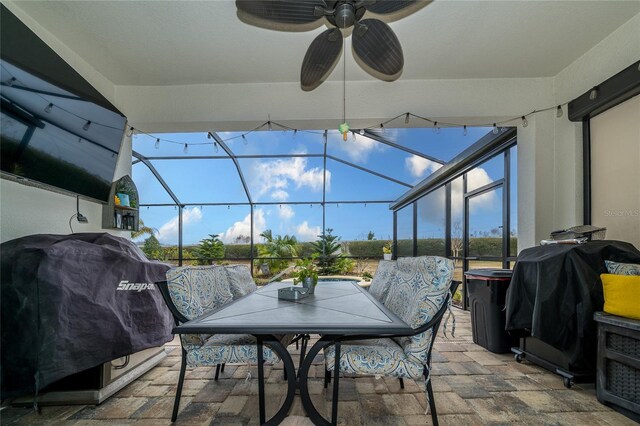 4748 Ballast Crest Cv, Land O Lakes, FL 34638 - view of patio / terrace with a grill, ceiling fan, glass enclosure, and outdoor dining area
