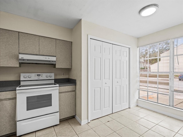 kitchen featuring gray cabinets, white electric range, and light tile patterned floors