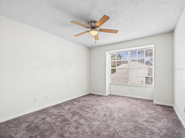 spare room with ceiling fan, carpet floors, and a textured ceiling