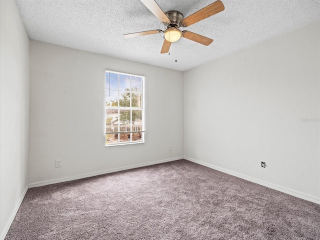 empty room featuring ceiling fan, carpet flooring, and a textured ceiling