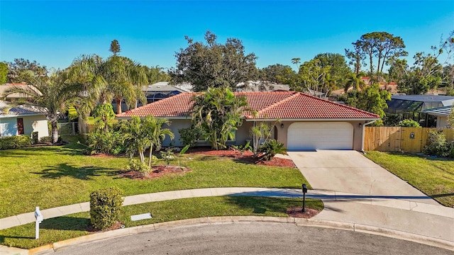 view of front of property with a garage and a front lawn