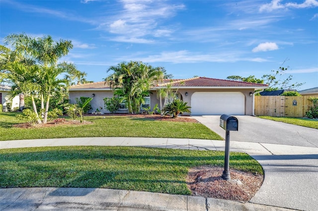 view of front of property with a garage and a front yard