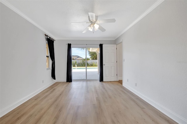 spare room featuring ceiling fan, ornamental molding, a textured ceiling, and light wood-type flooring