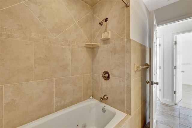 bathroom featuring tiled shower / bath combo and tile patterned floors